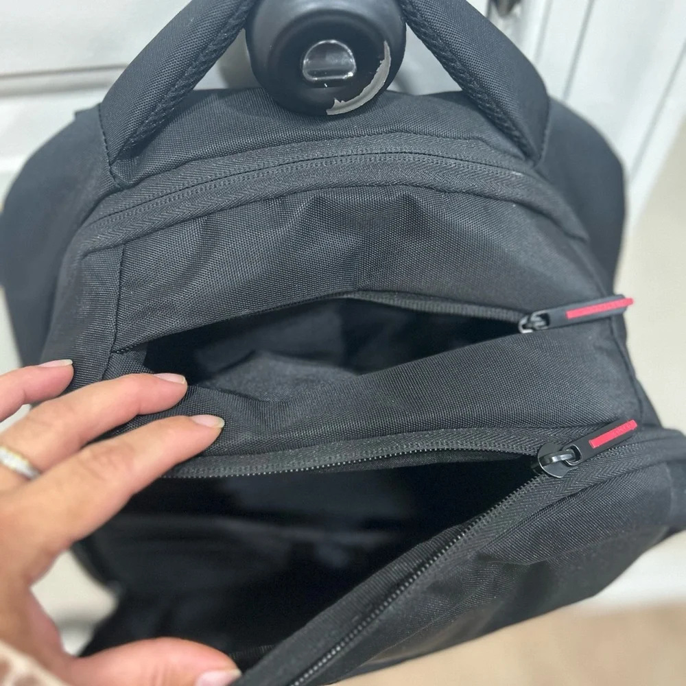 Compact Black Men's Backpack with Subtle Red Accents